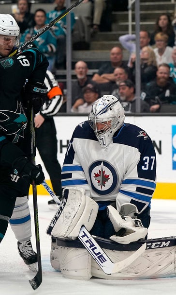 Hellebuyck's 51 saves lead Jets past Sharks 3-2